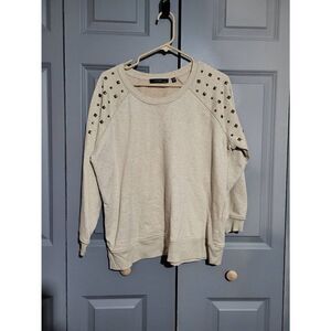 Cyrus woman cream color sweater with studs over shoulders